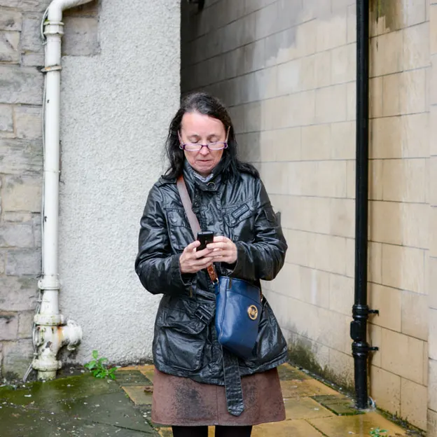 People Standing While On Their Mobiles — photograph 18 of 23