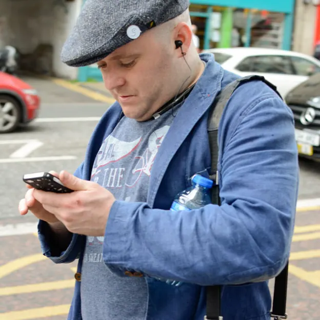 People Walking While On Their Mobiles — photograph 10 of 28