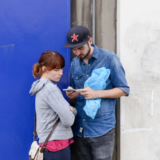 People Standing While On Their Mobiles — photograph 12 of 23