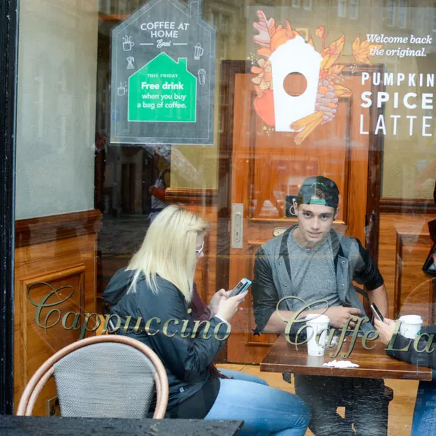 People Sitting While On Their Mobiles — photograph 22 of 25