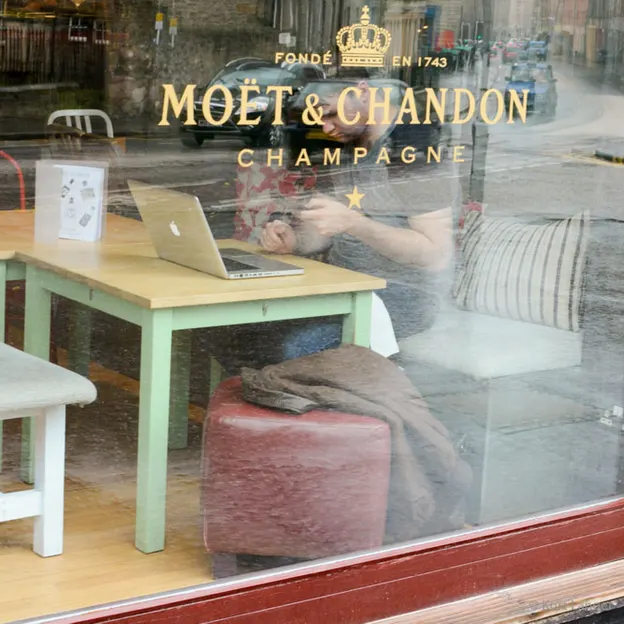 People Sitting While On Their Mobiles — photograph 20 of 25
