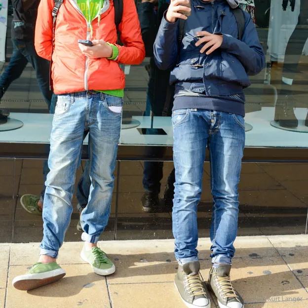 People Standing While On Their Mobiles — photograph 14 of 23