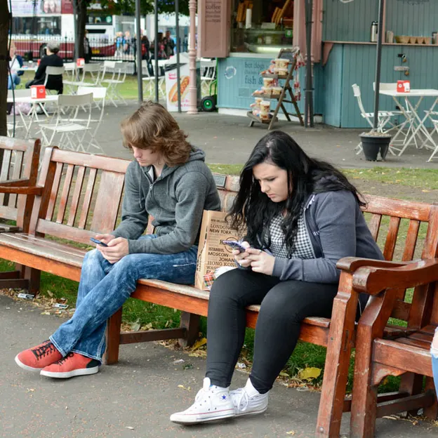 People Sitting While On Their Mobiles — photograph 11 of 25