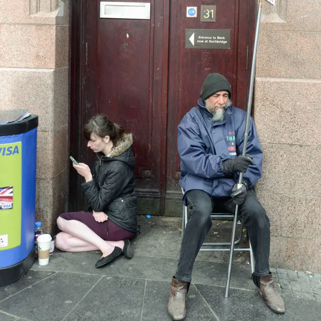 People Sitting While On Their Mobiles — photograph 13 of 25