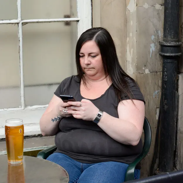 People Sitting While On Their Mobiles — photograph 9 of 25