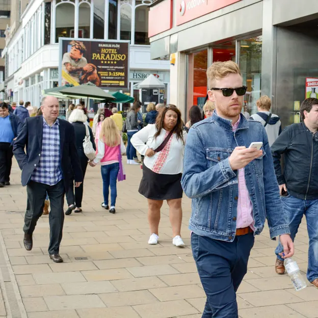 People Walking While On Their Mobiles — photograph 19 of 28