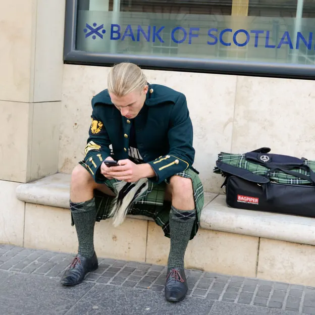 People Sitting While On Their Mobiles — photograph 15 of 25