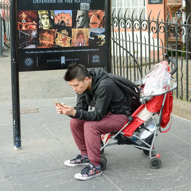 People Sitting While On Their Mobiles — photograph 21 of 25