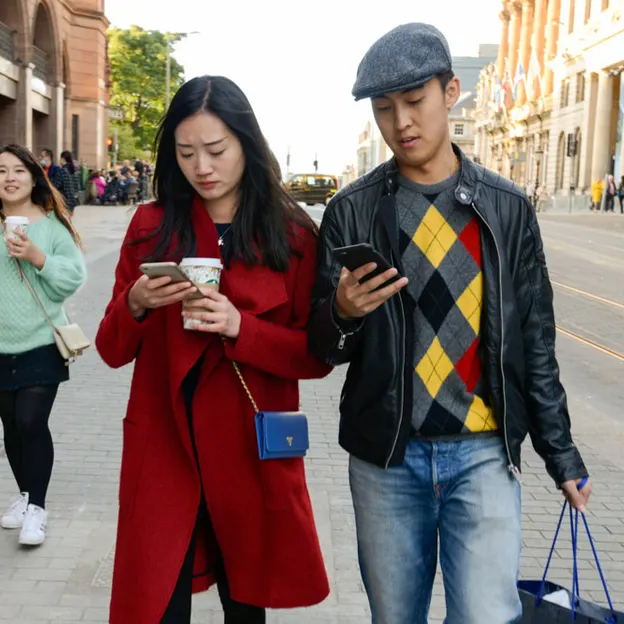 People Walking While On Their Mobiles — photograph 27 of 28