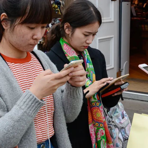 People Standing While On Their Mobiles — photograph 21 of 23