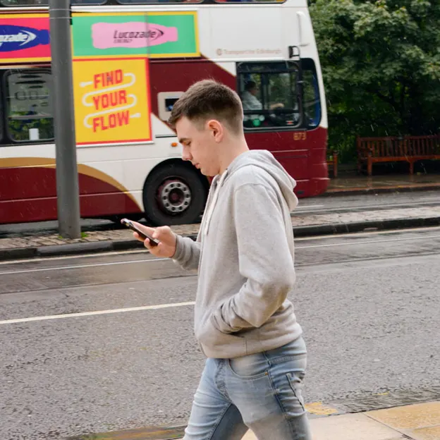 People Walking While On Their Mobiles — photograph 16 of 28