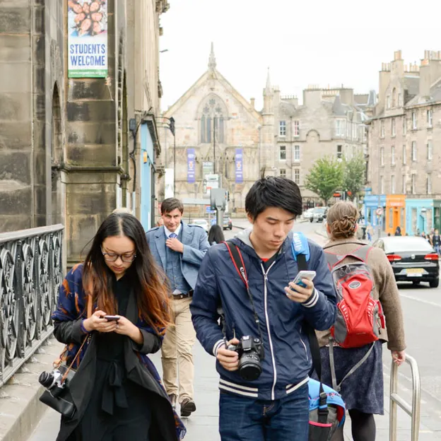 People Walking While On Their Mobiles — photograph 25 of 28