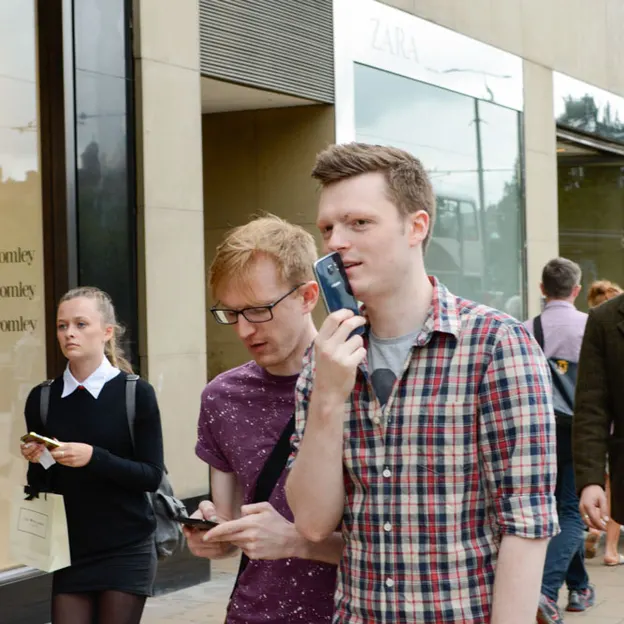 People Walking While On Their Mobiles — photograph 21 of 28