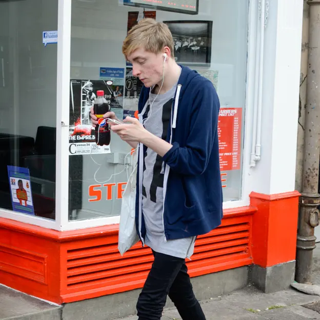People Walking While On Their Mobiles — photograph 11 of 28